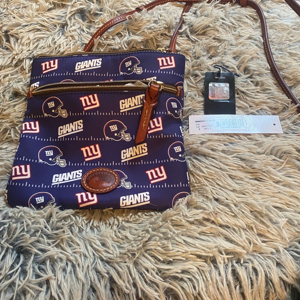 Dooney & Bourke NY Giants crossbody bag with adjustable leather strap.
